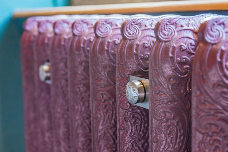 ornate pink cast iron radiator in Edwardian stately home